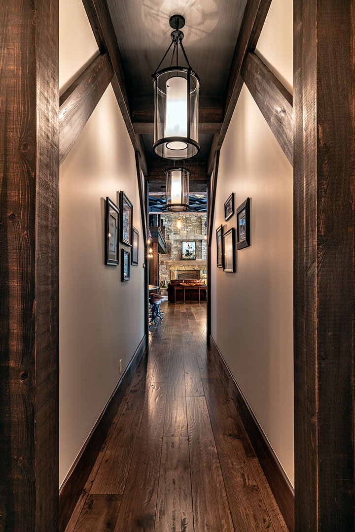 Hallway to the great room with beams and textured ceiling
